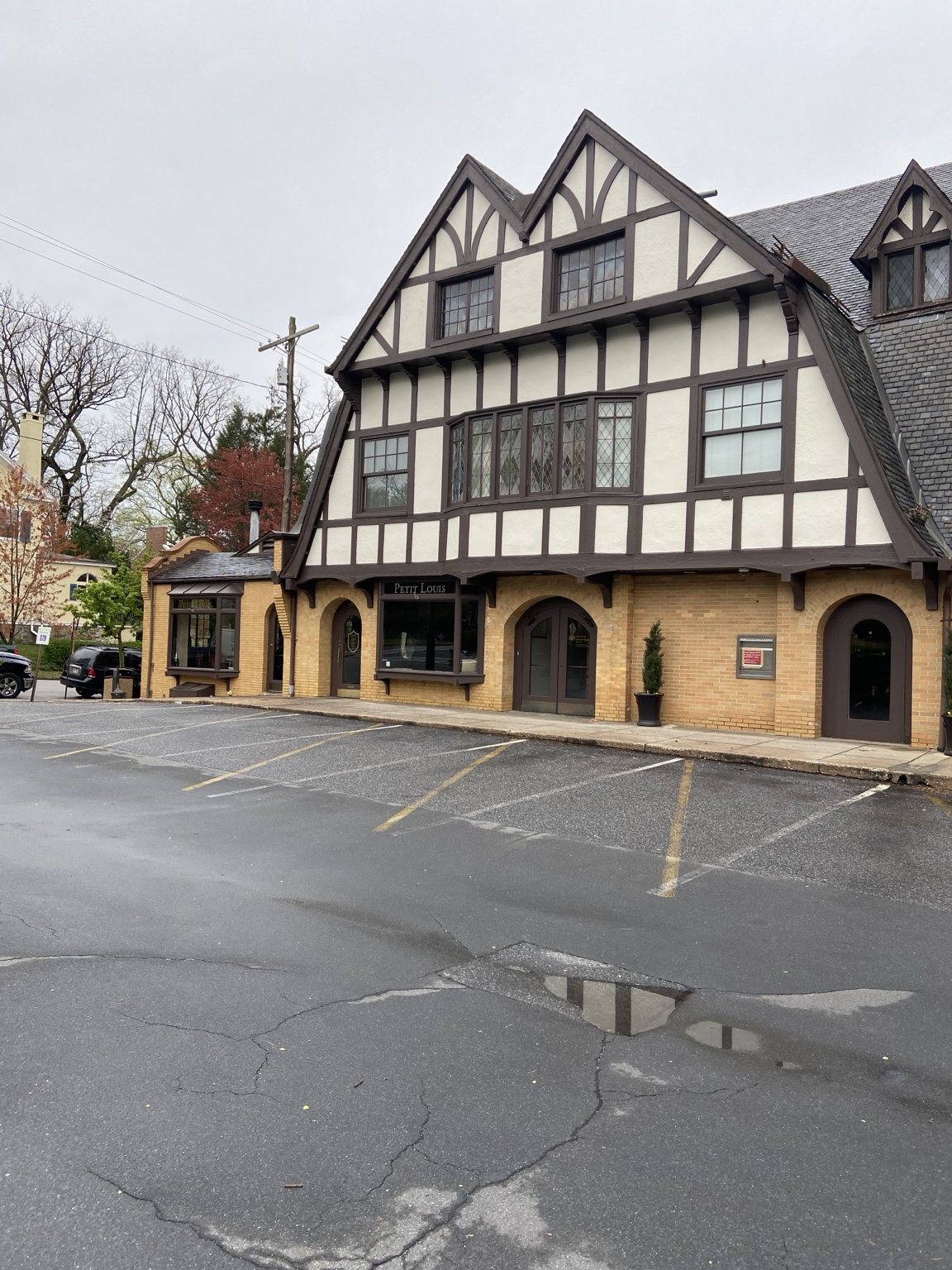 Color My World Painting crew repainting a large Tudor-style commercial building in Maryland